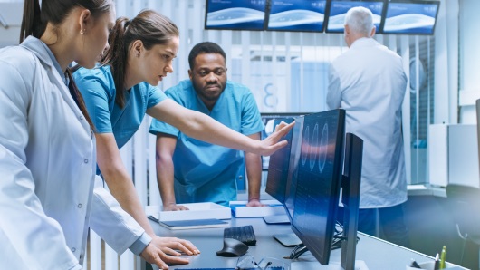Medical team reviewing diagnostic imaging